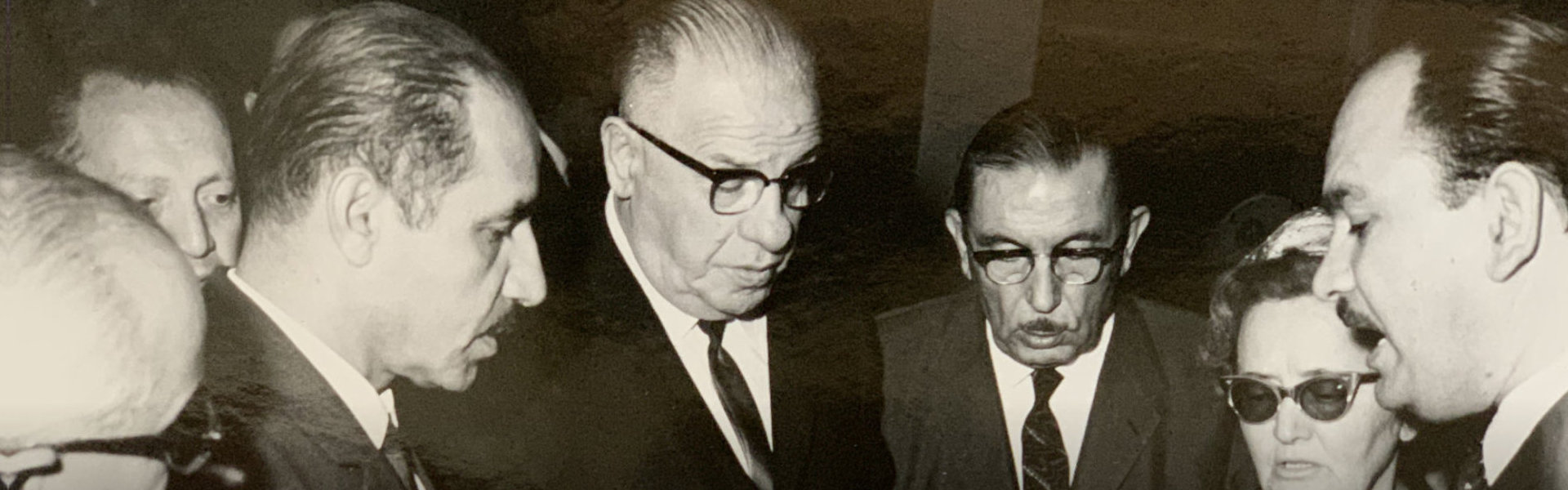 black and white photo of owner with his colleagues