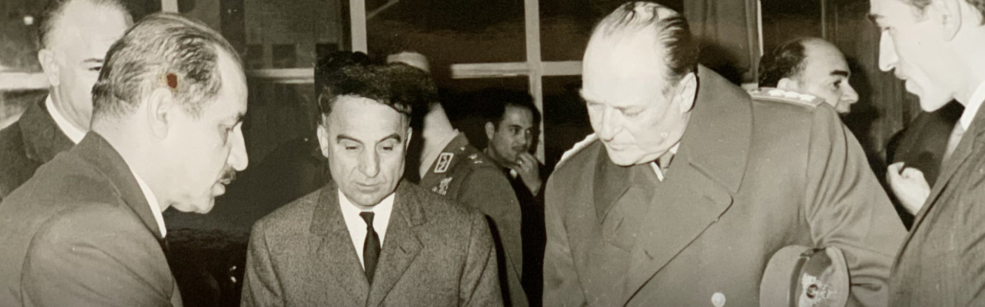 black and white photo of owner with his colleagues