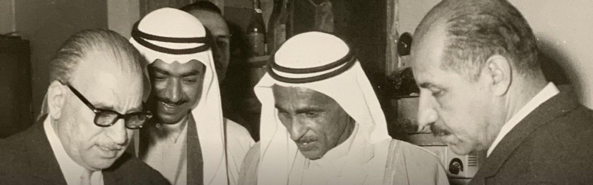 black and white photo of owner with his colleagues