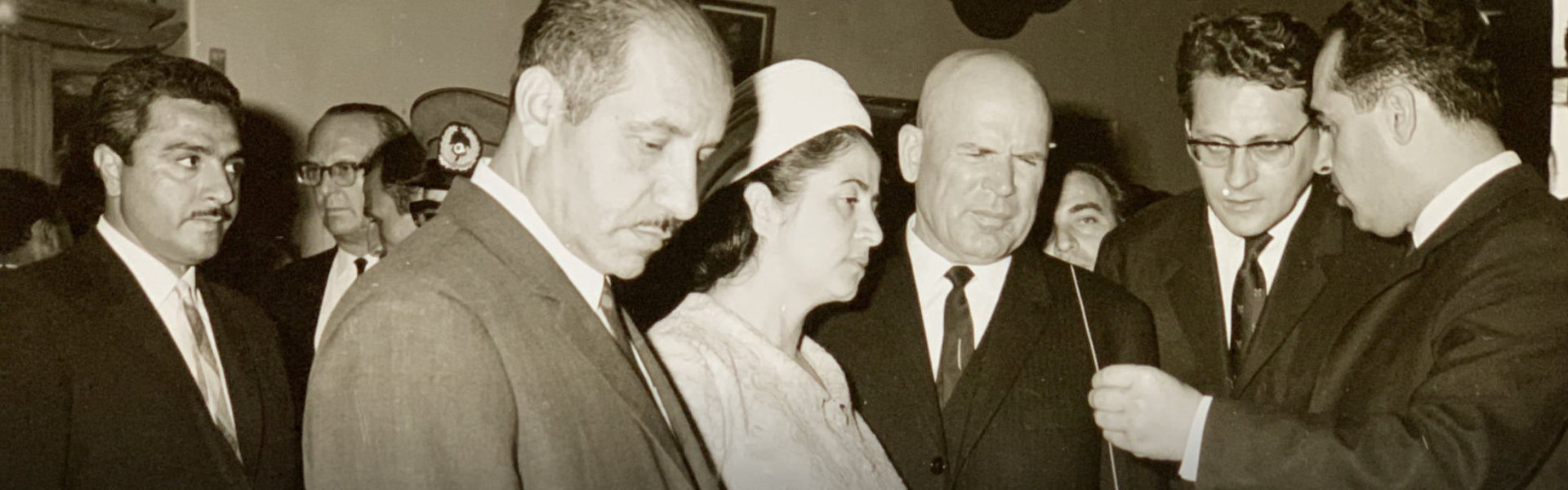 black and white photo of owner with his colleagues